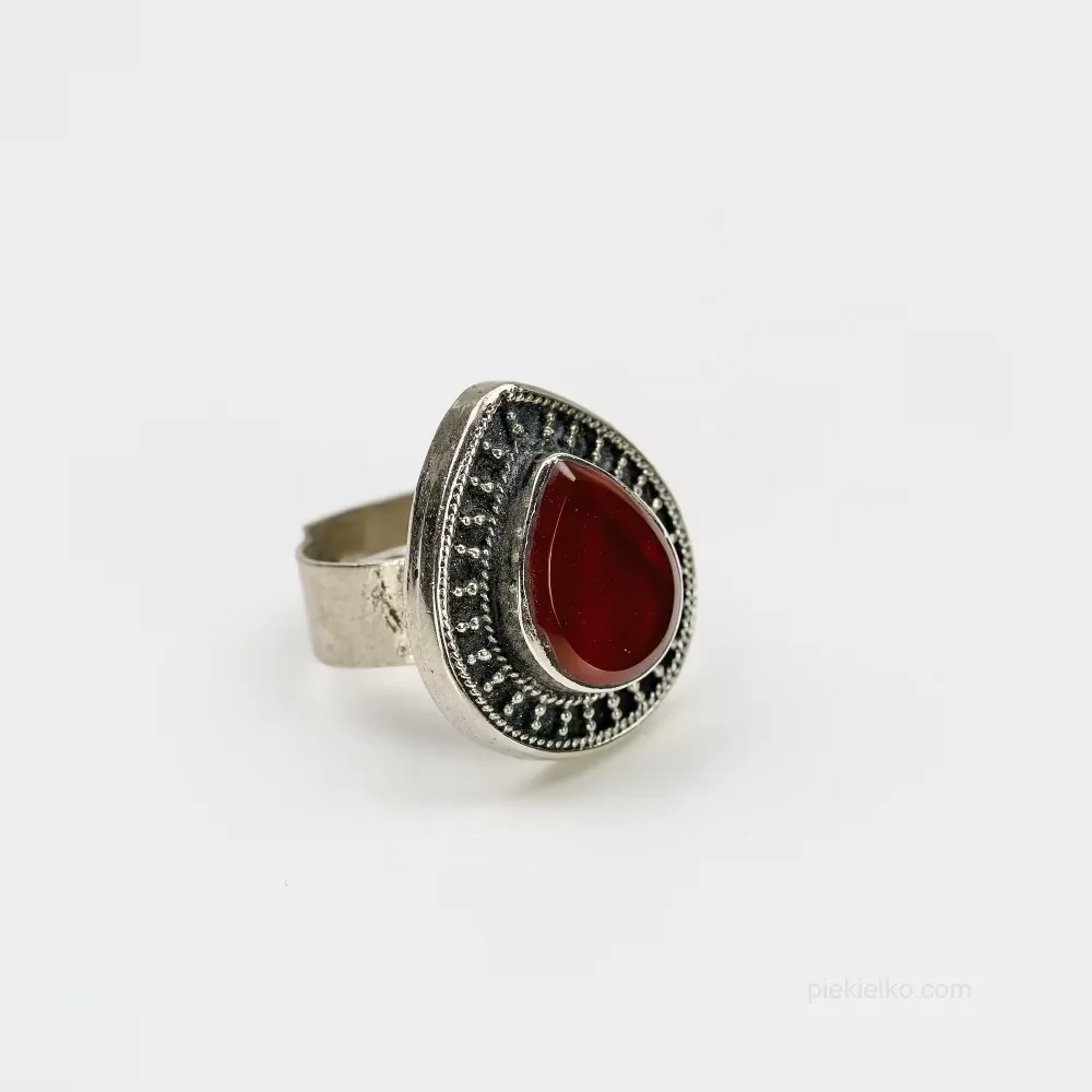 Red drop in a crown of oxidized metal